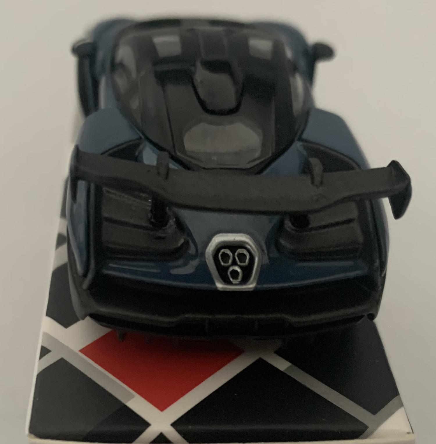 An excellent scale model of a McLaren Senna decorated in victory grey with black roof  and silver wheels.  Other trims are finished in black and yellow