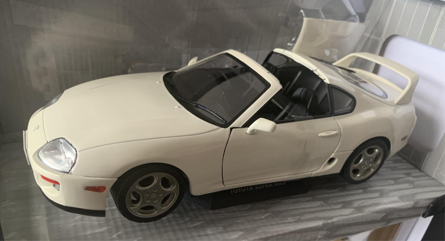 A very good representation of the Toyota Supra Targa mk 4 decorated in white with high rear spoiler, side air vents