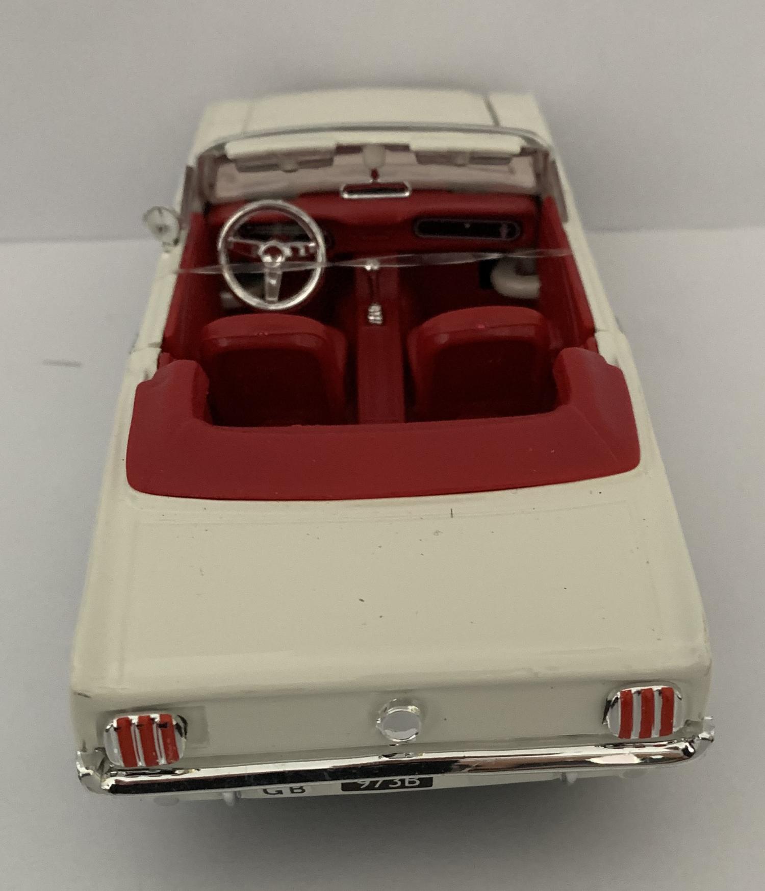 An excellent scale model of a Ford Mustang ½ in white with authentic graphics and chrome wheels.