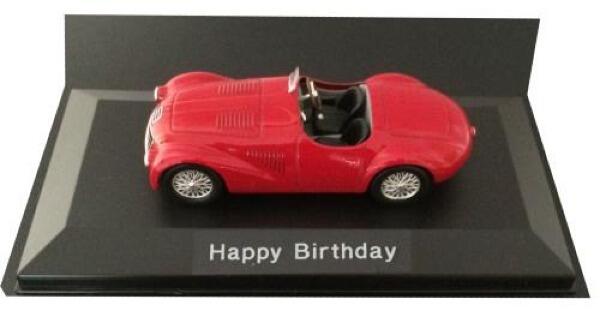 Happy Birthday Ferrari 125 S in red, 1947, 1:43 scale diecast car model mounted on a plinth with a hard cover