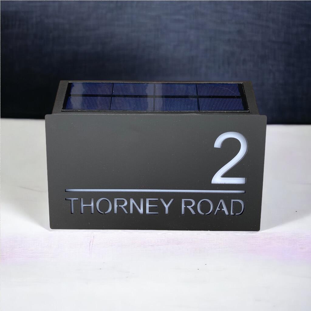 Solar powered illuminated led house number store rock display