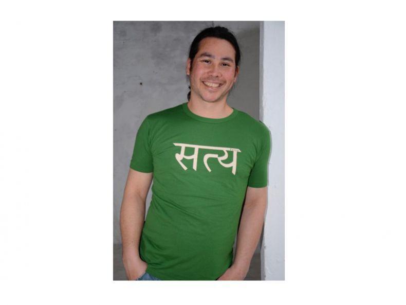 Man wearing green bamboo t shirt with satya written in devanagari in white