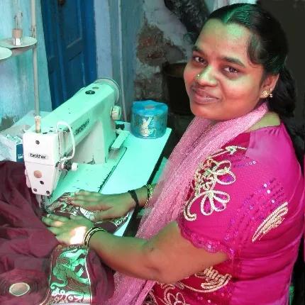Woman sewing a yogamalai fairtrade yoga kit bag