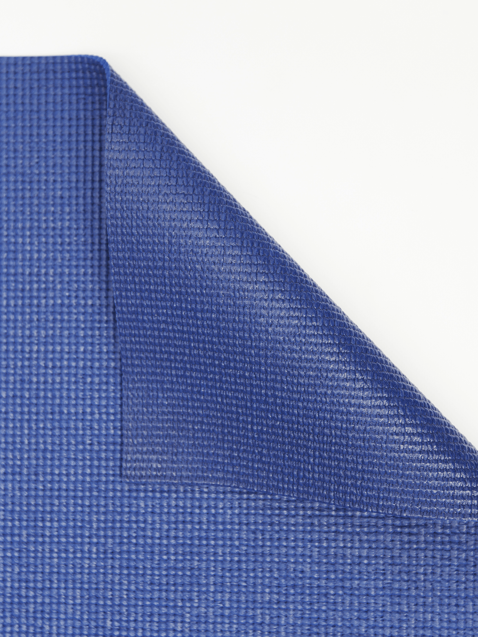 close up folded corner blue yoga mat