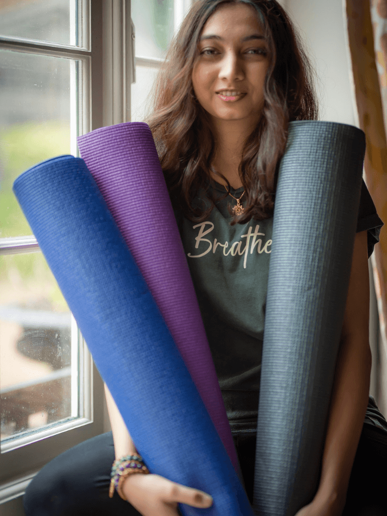 model with varraition colours yoga mats holding