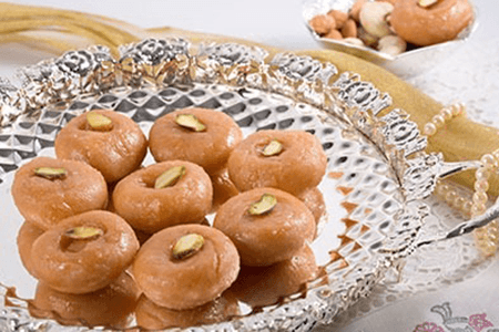 Product photo of Badusha. A very traditional Indian Sweets available from the interiors of India.