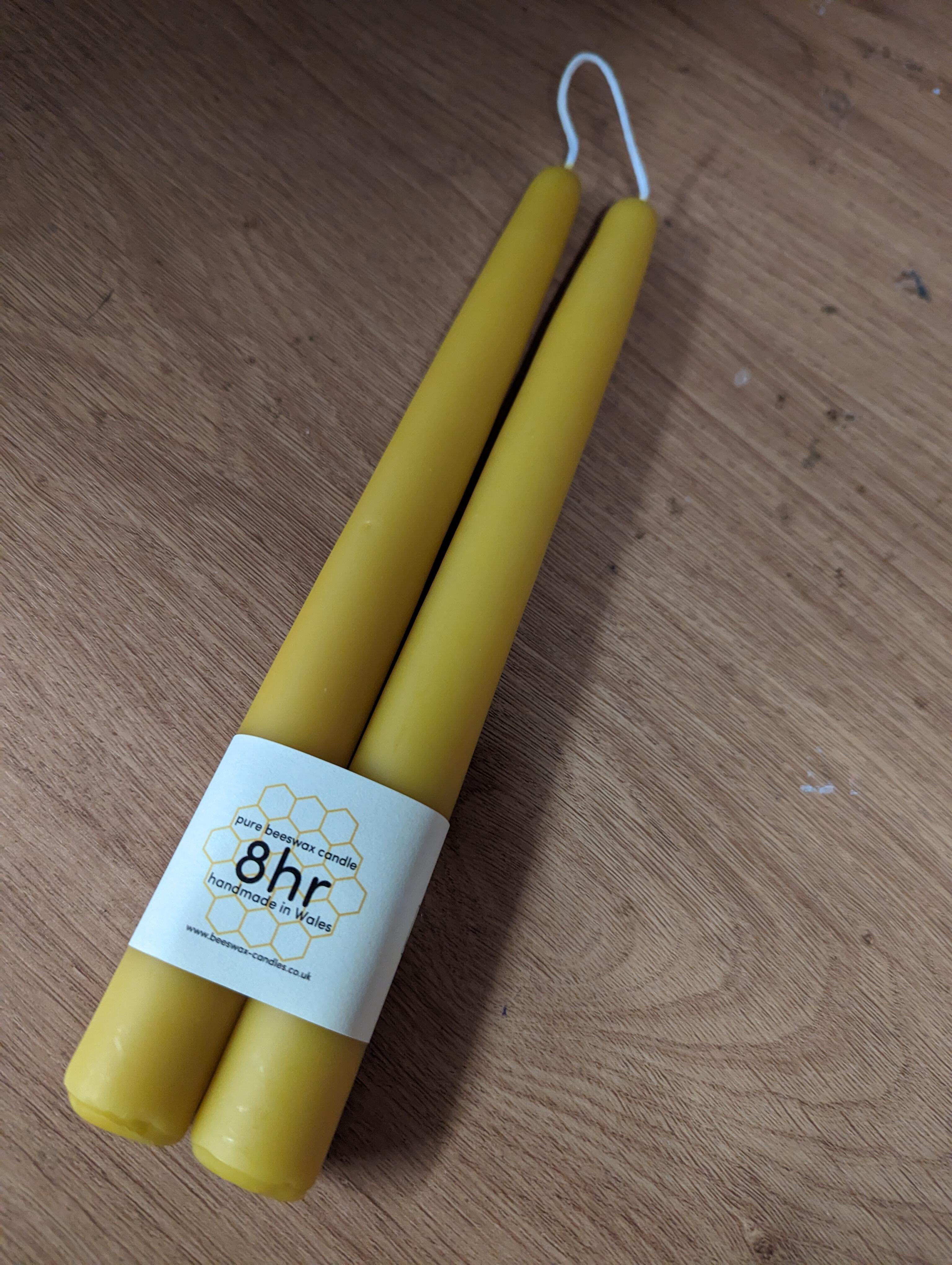 Pair of traditional dipped beeswax candles