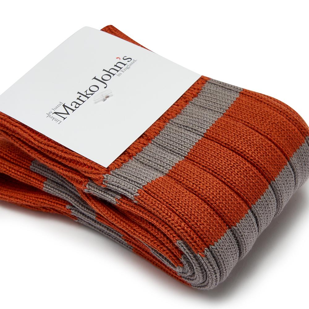 Marko John's Whistler socks in orange and grey stripes