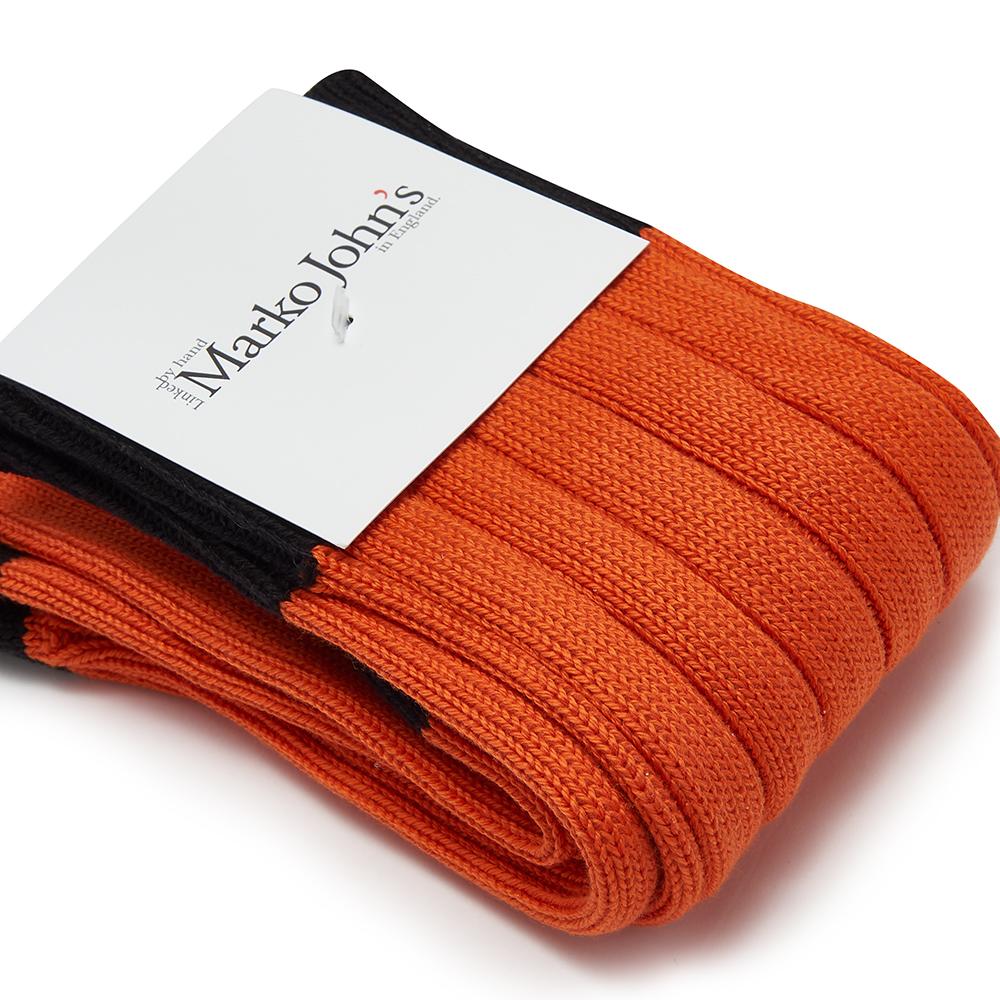 Marko John's Lambo socks in orange with black cuff, heel, and toe