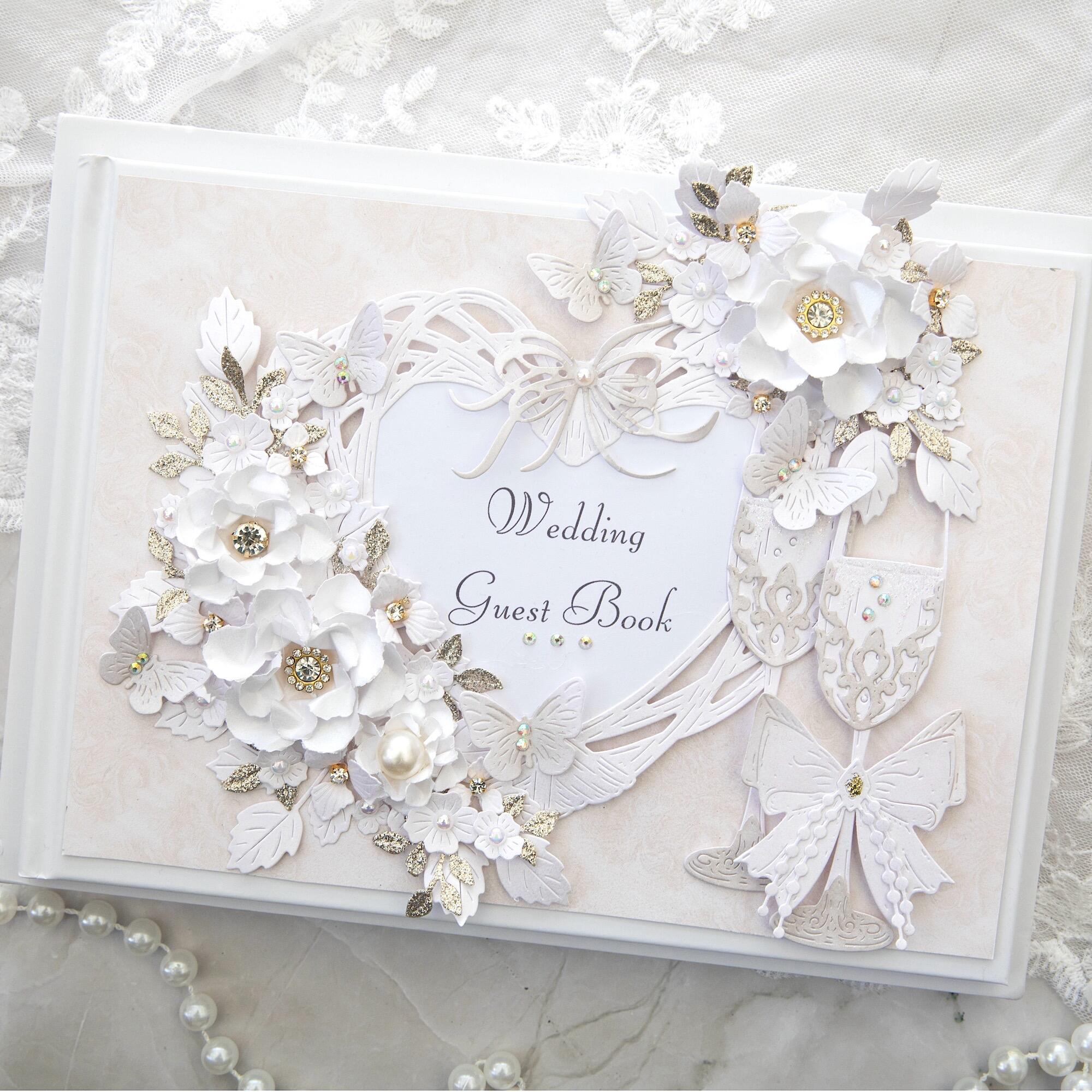 Luxury handmade gold wedding guest book with 3D white flowers, gold glitter leaves, champagne glasses and bows, personalised UK