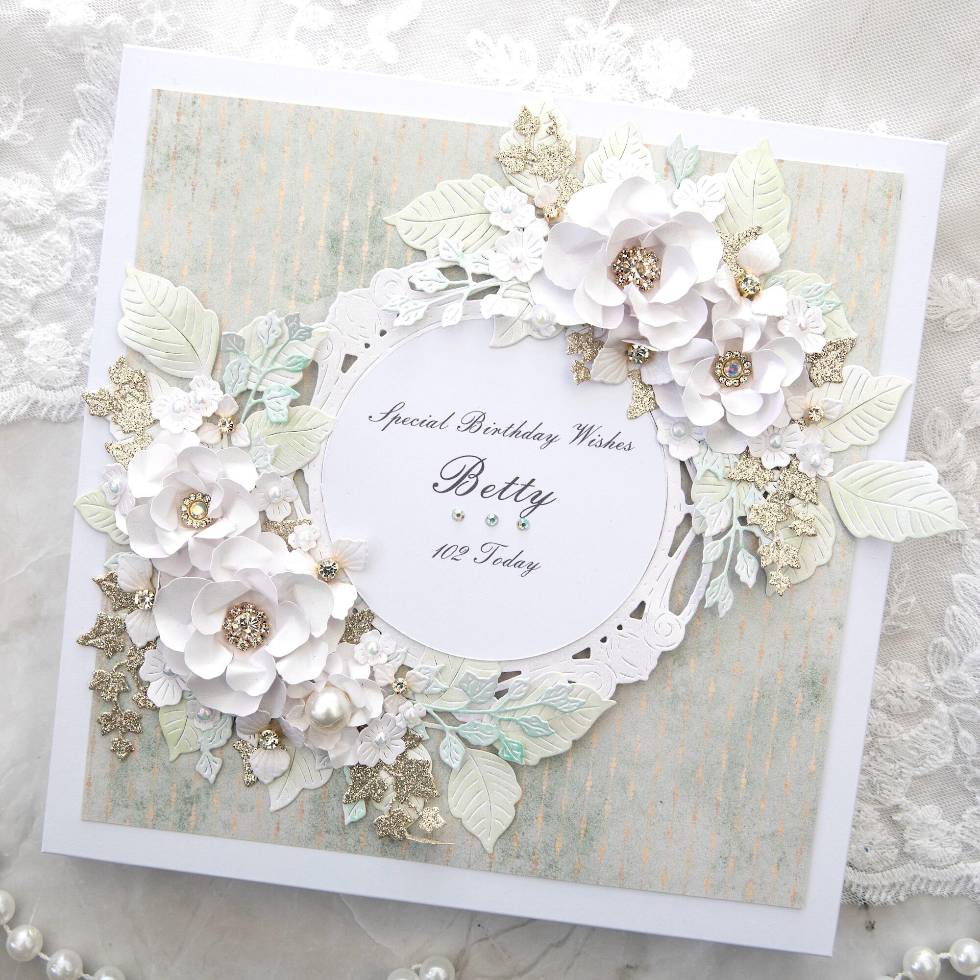 Luxury handmade 102nd birthday card made in Leicestershire with white 3D flowers, gold glitter leaves, sage green background, personalised for Betty, gift boxed