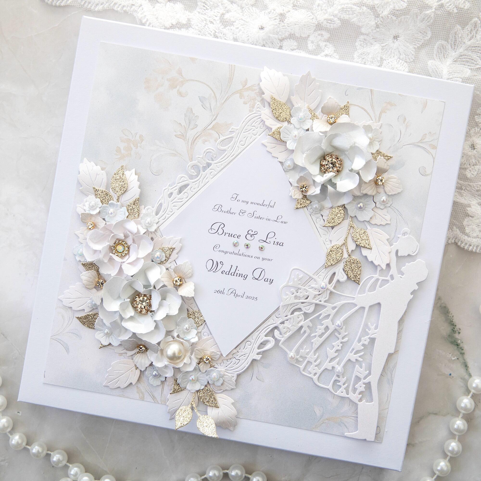 Handmade wedding card for brother and sister in law with white 3D flowers, champagne gold glitter leaves, embossed frame and bride groom silhouette