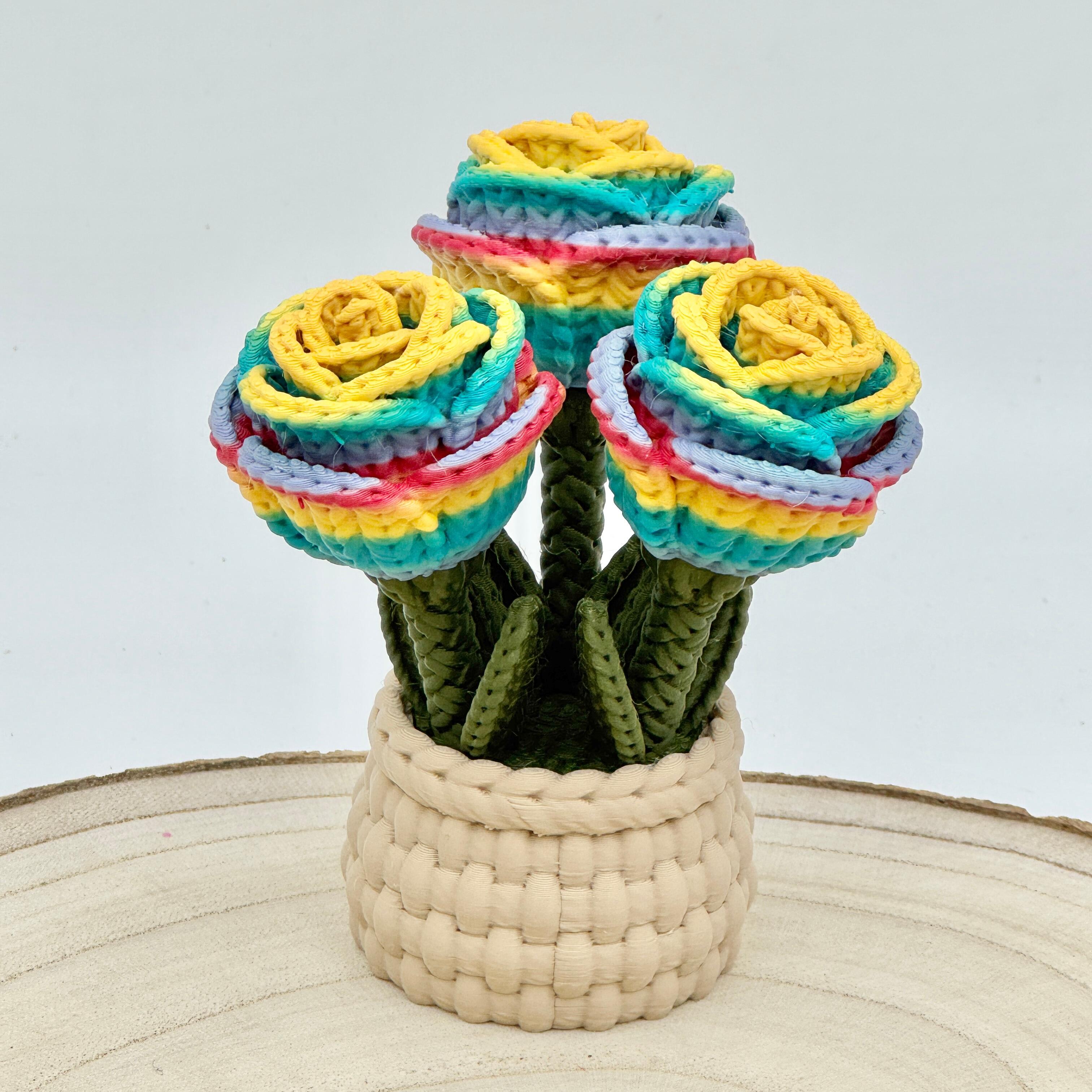 rainbow knitted effect roses in a light brown woven basket
