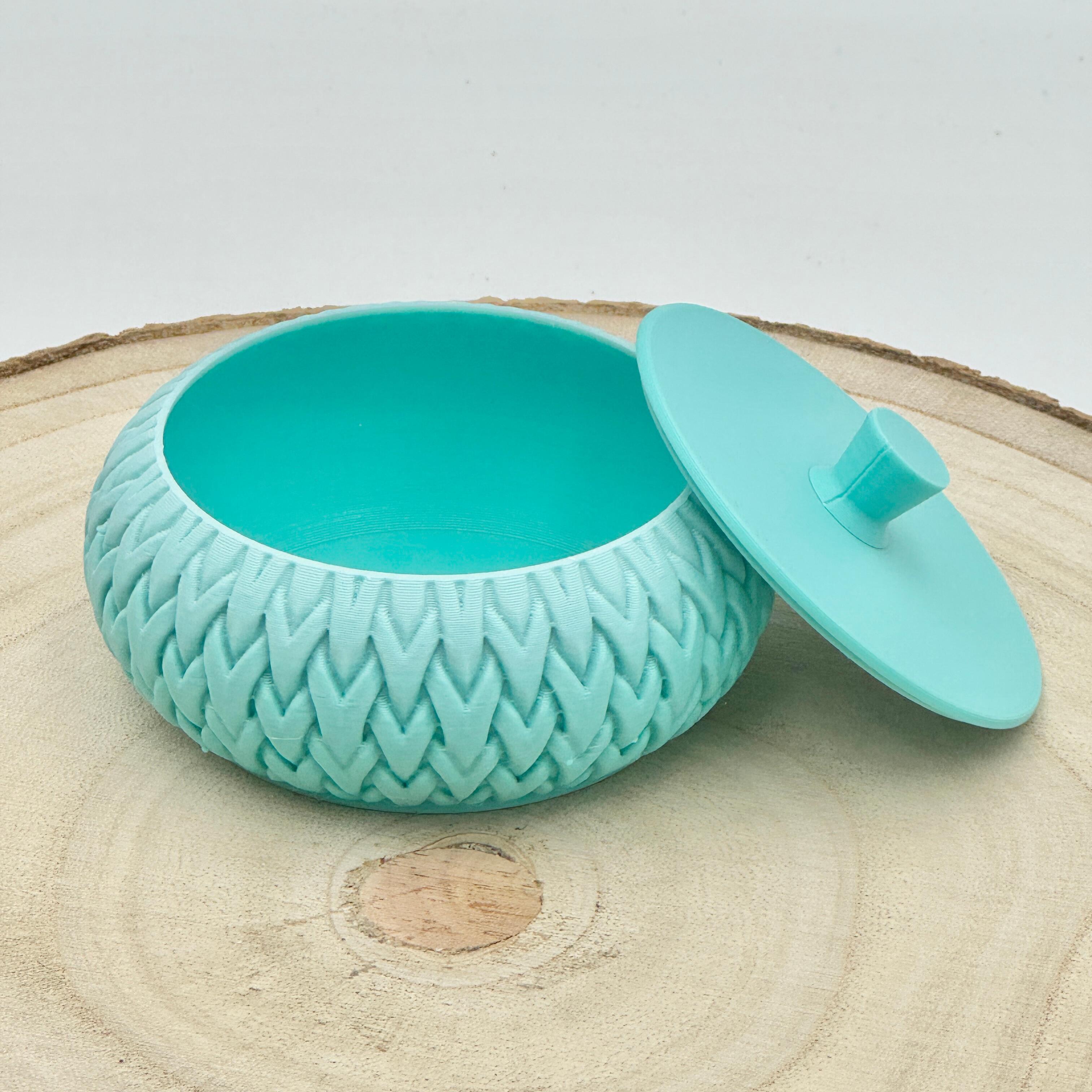 an image of a stackable lidded pot in shades of blue
