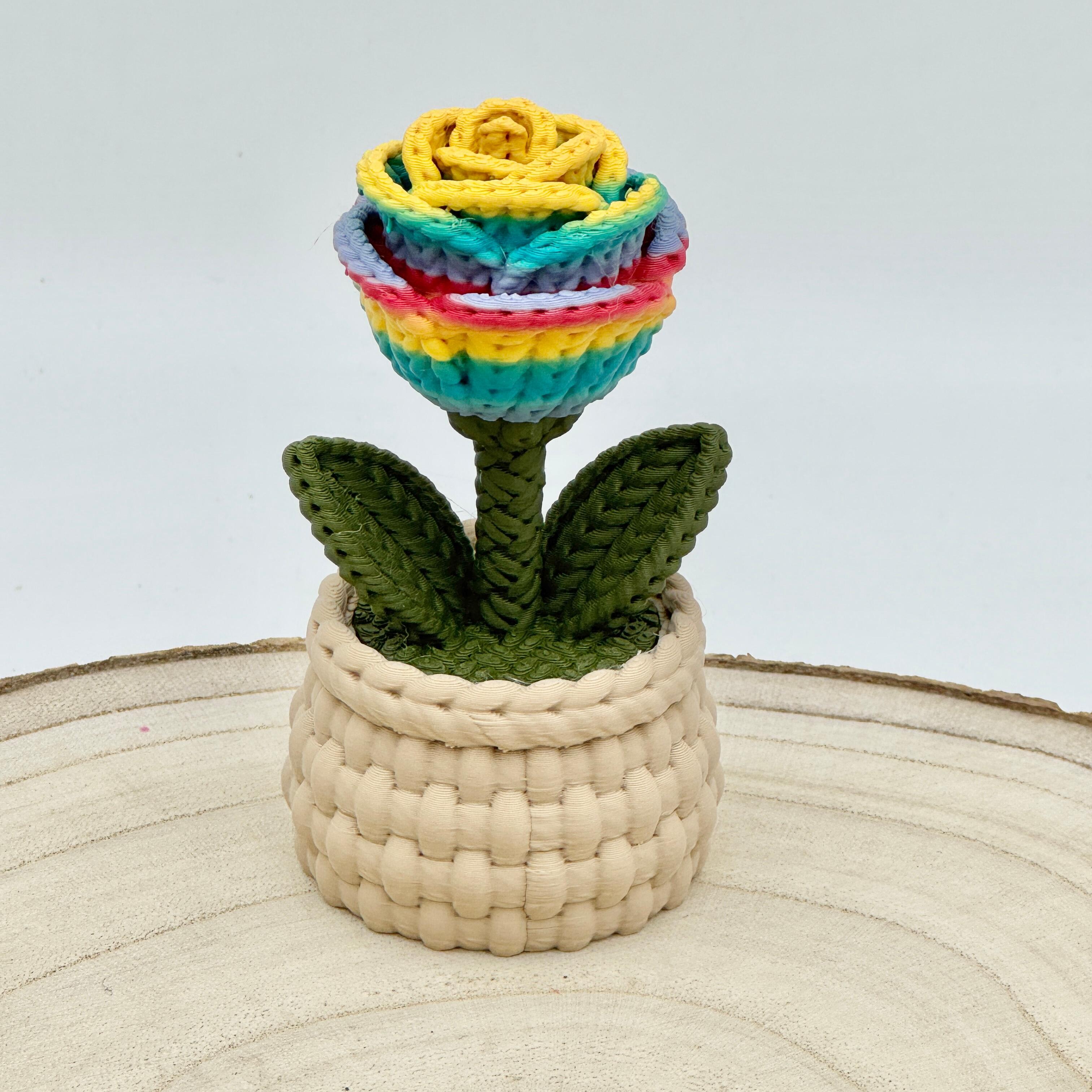 rainbow knitted effect roses in a light brown woven basket
