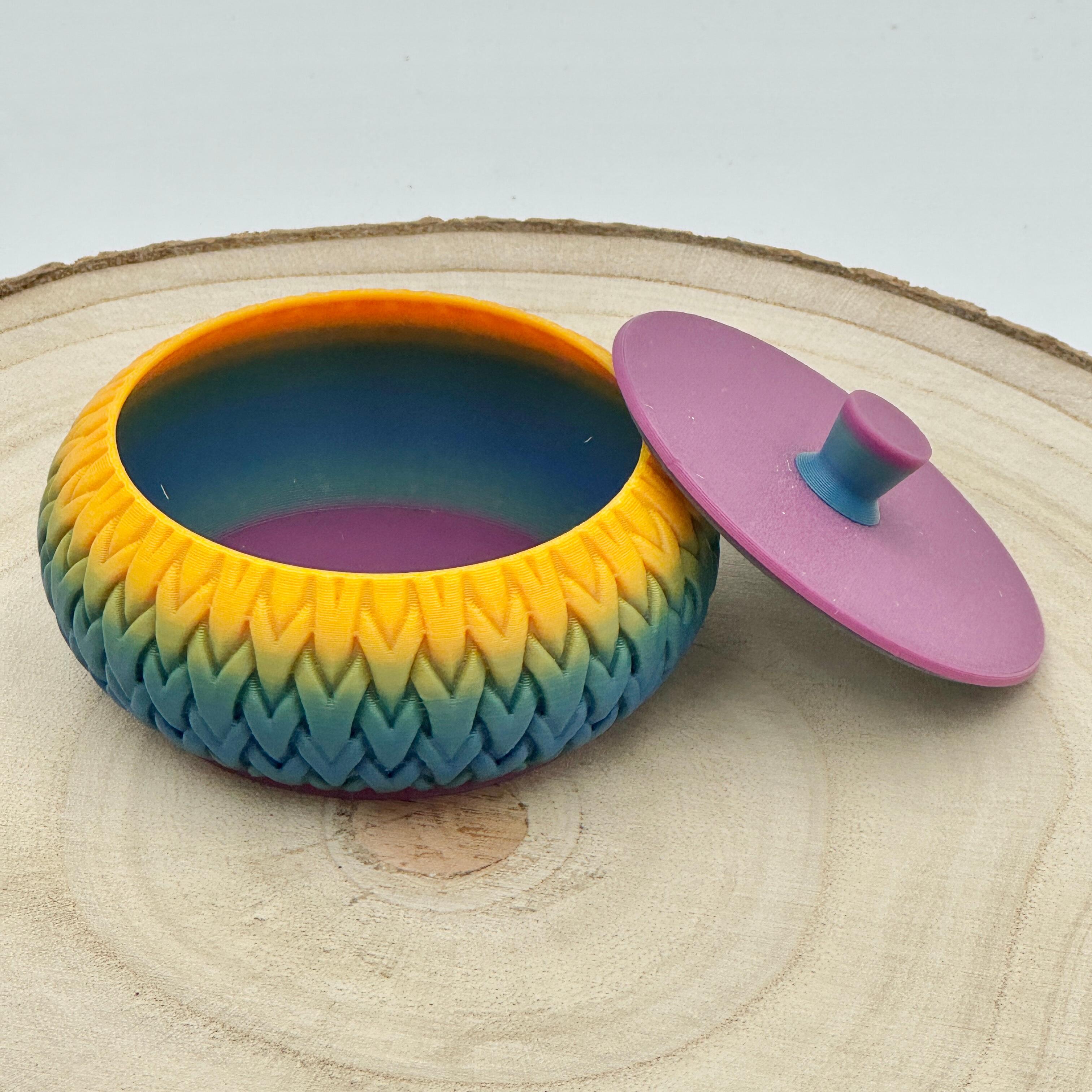 an image of a stackable lidded pot in bold rainbow colours