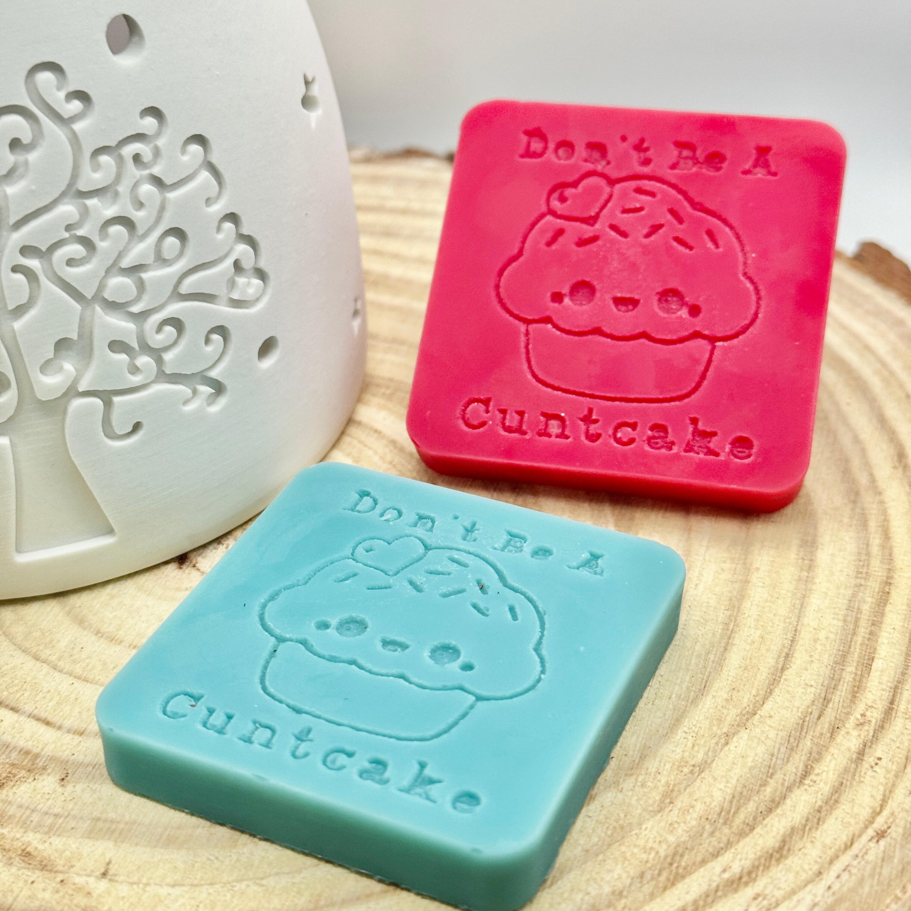 an image of a sweary wax melt square that reads cuntcake