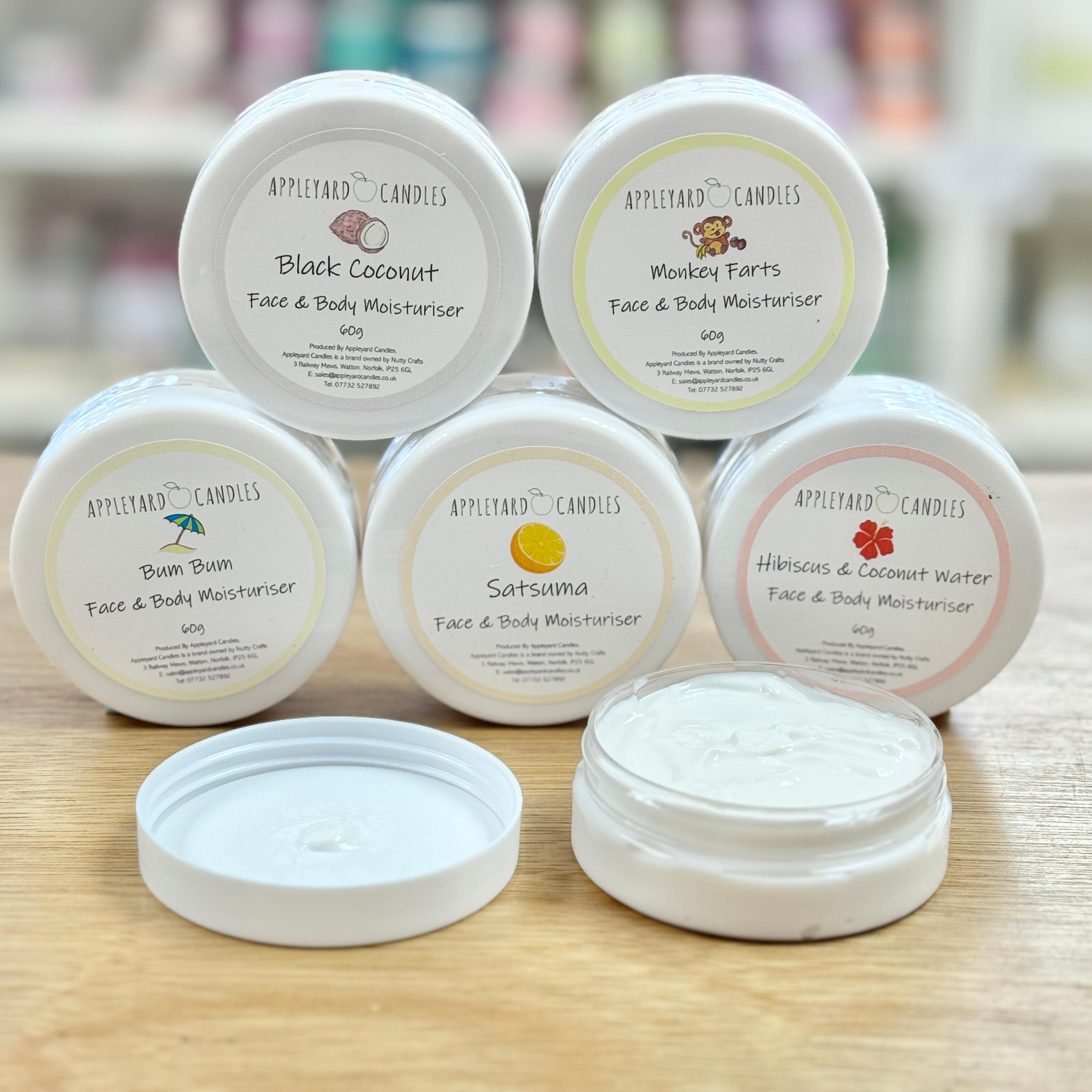 An image of a stack of tubs of moisturiser