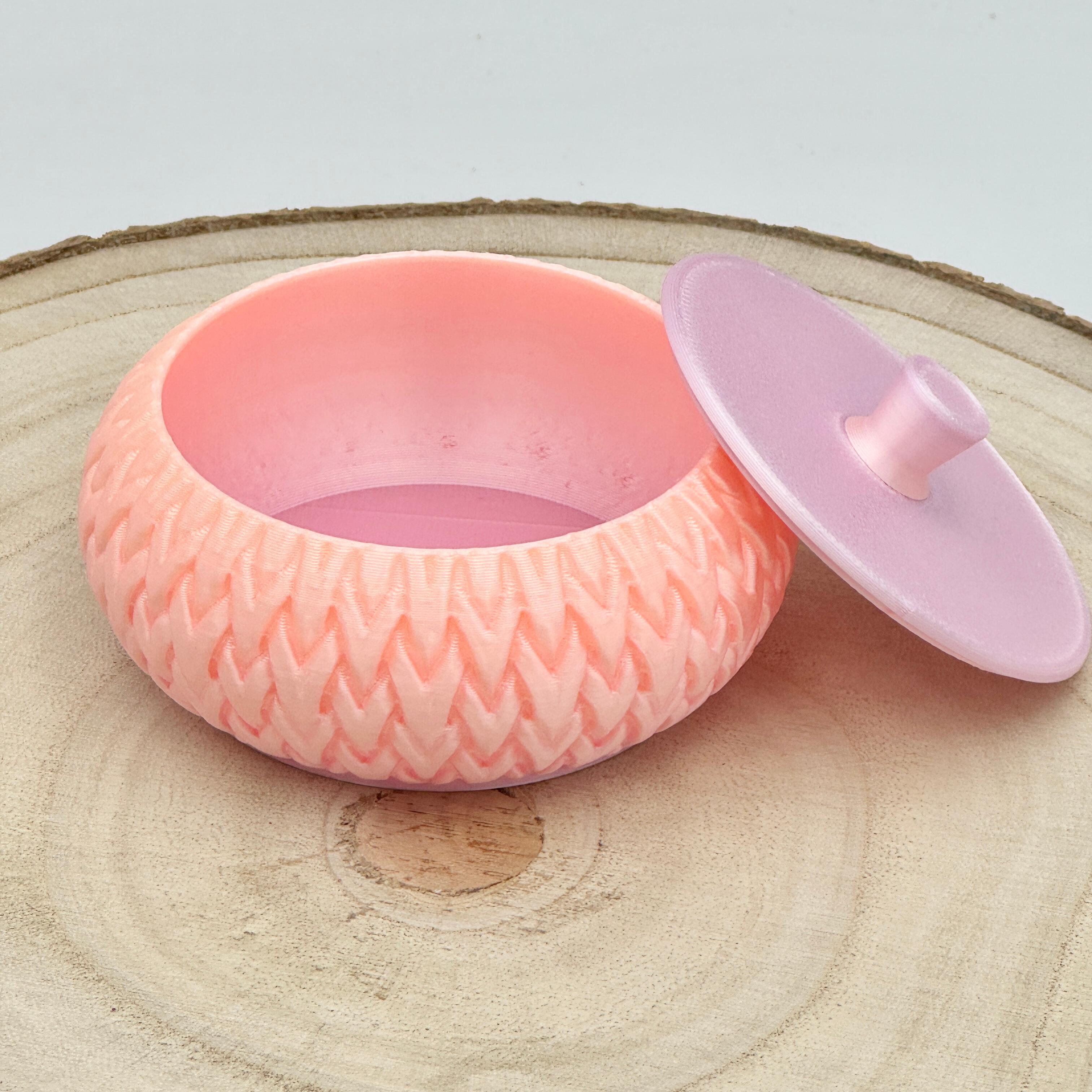 an image of a stackable lidded pot in a silk effect pink