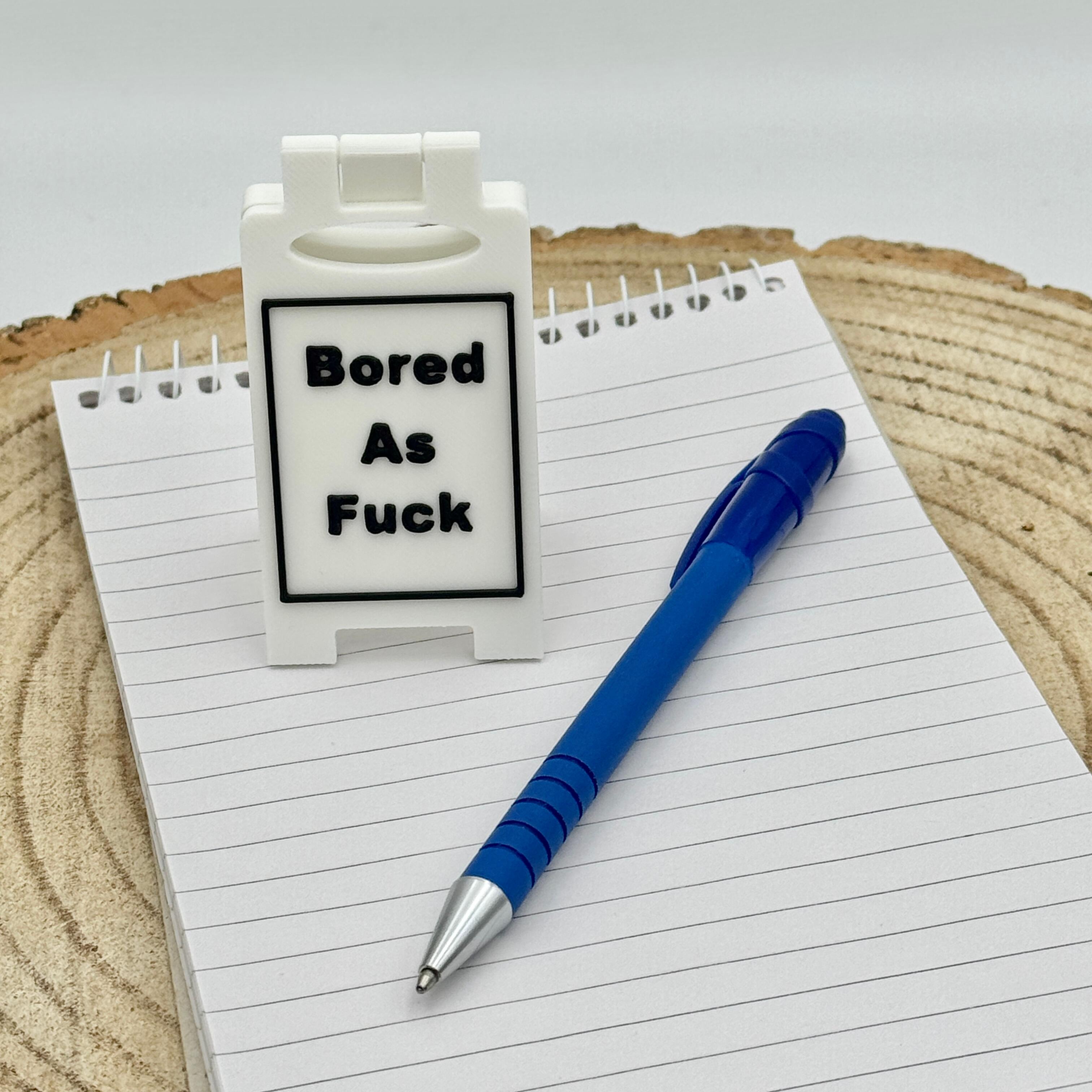 an image of a sweary or rude desk sign
