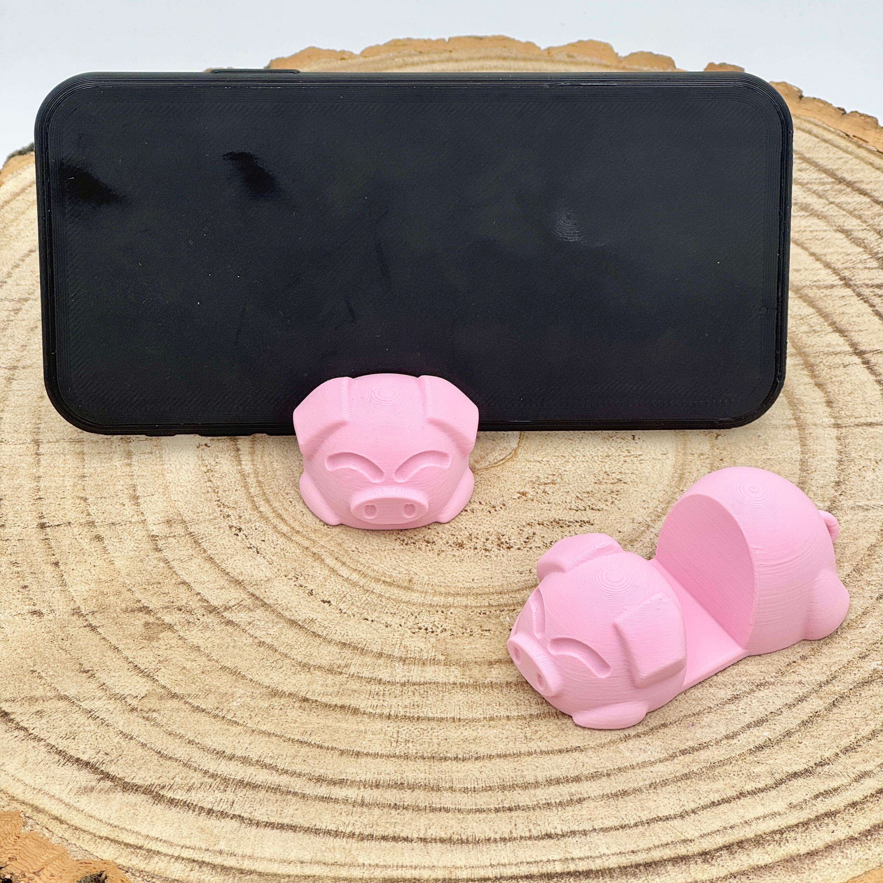 an image of a pink pig mobile phone holder