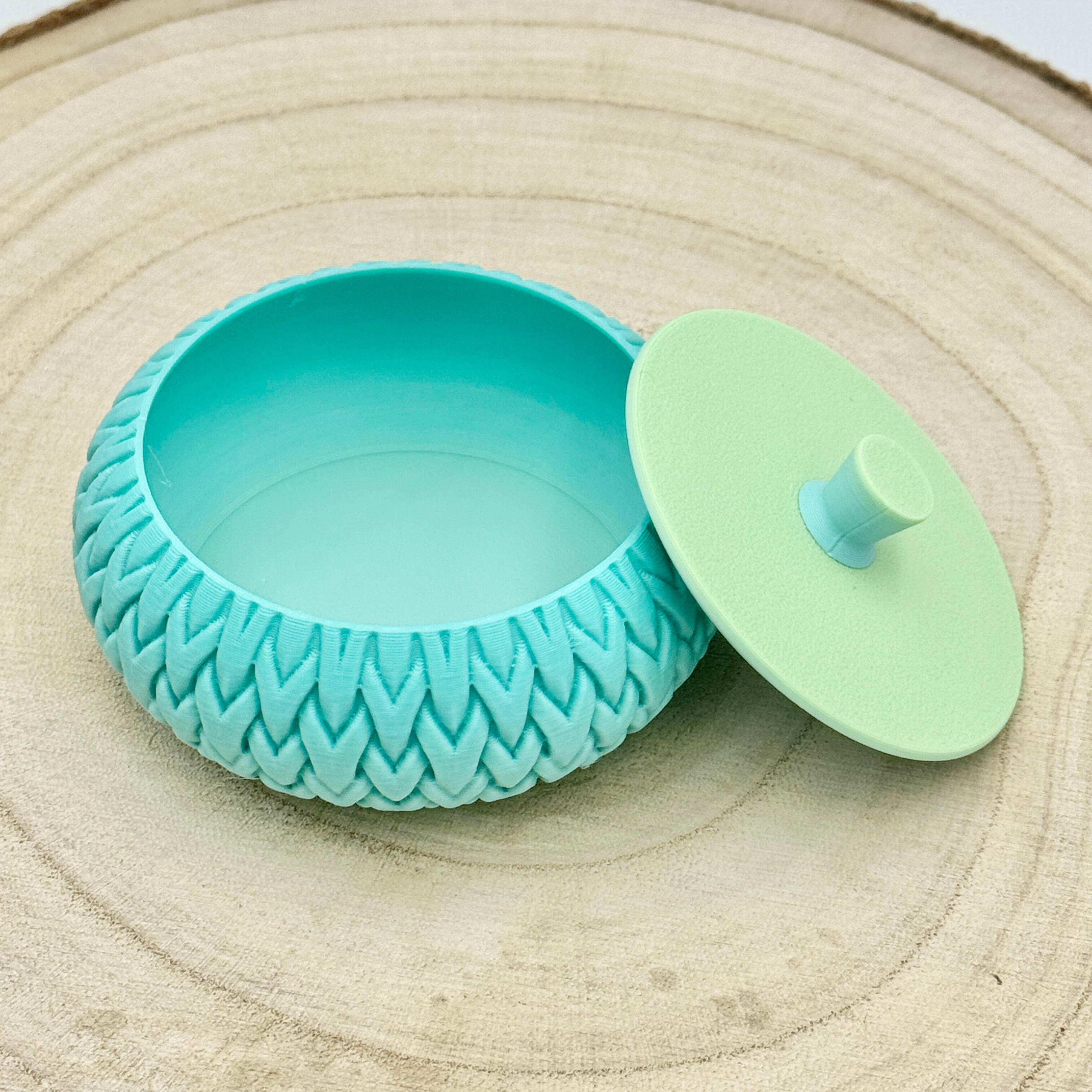 an image of a stackable lidded pot in shades of blue