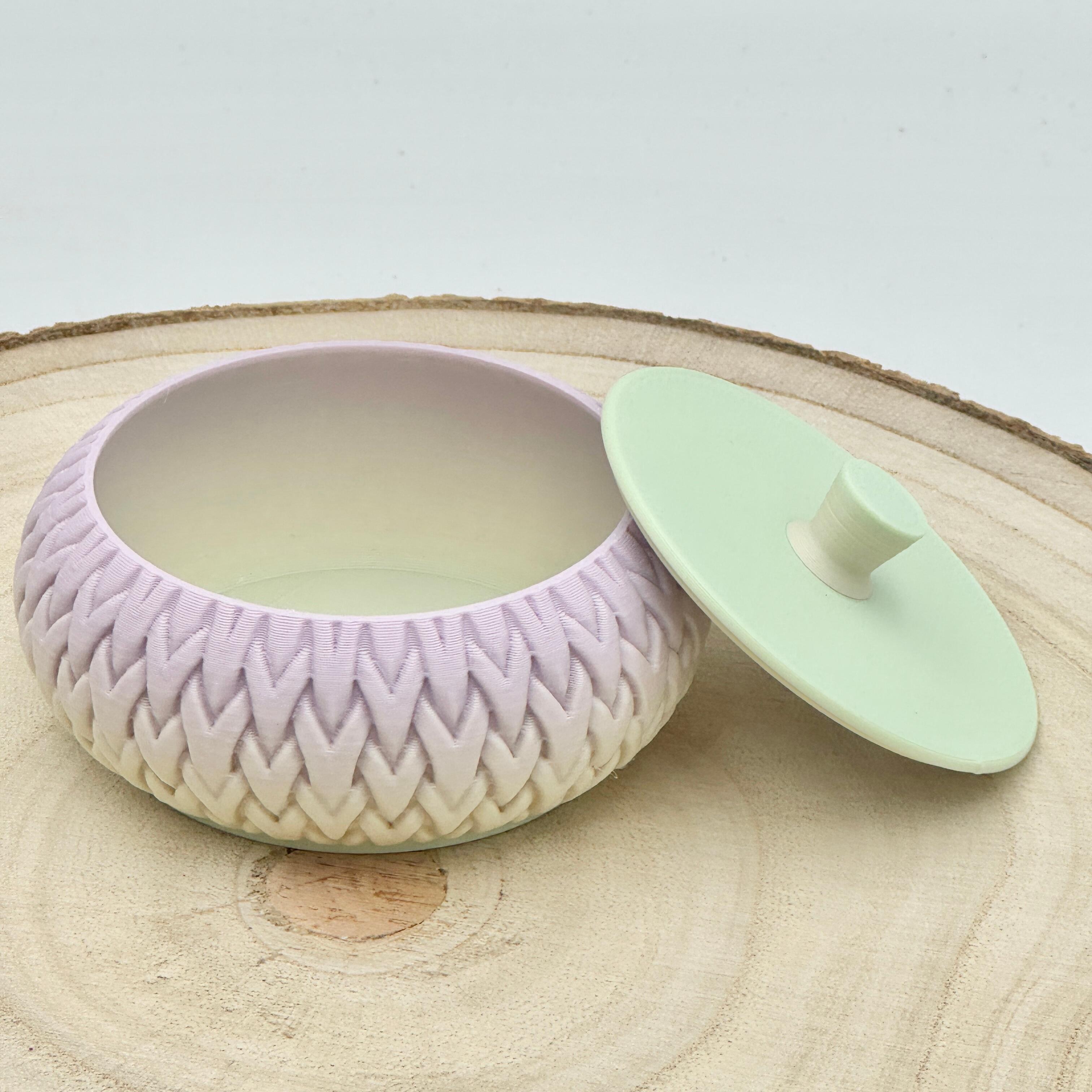 an image of a stackable lidded pot in pastel shades