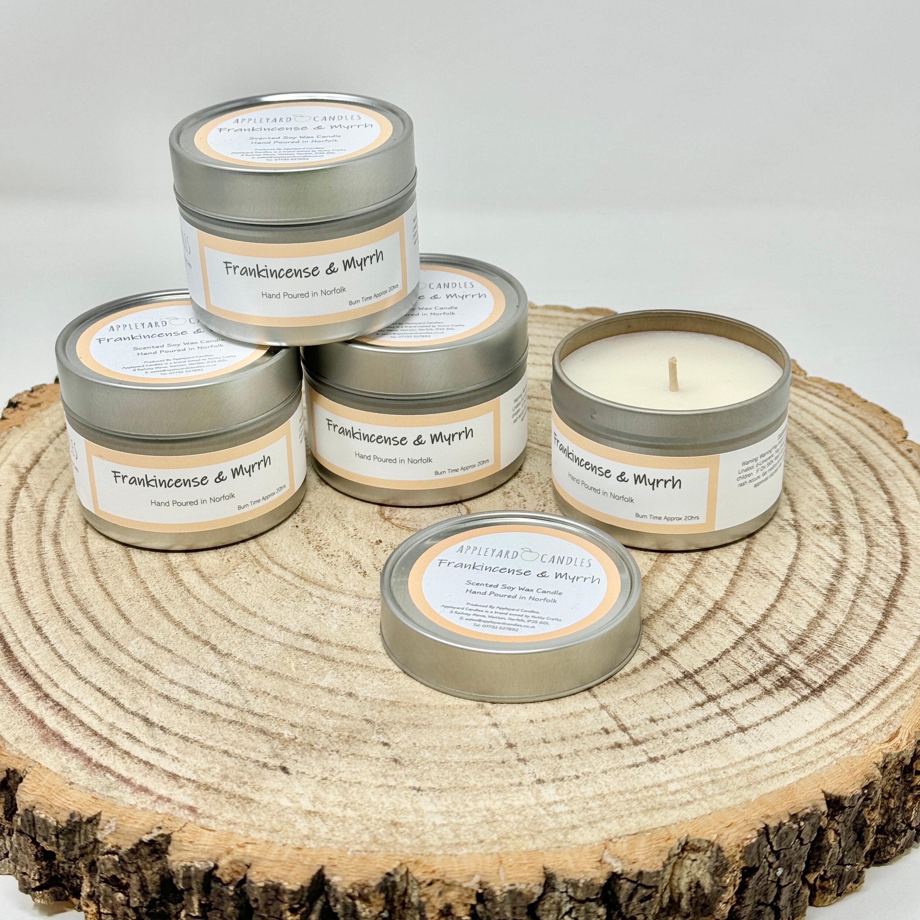 an image of frankincense & myrrh scented candles in aluminium tins
