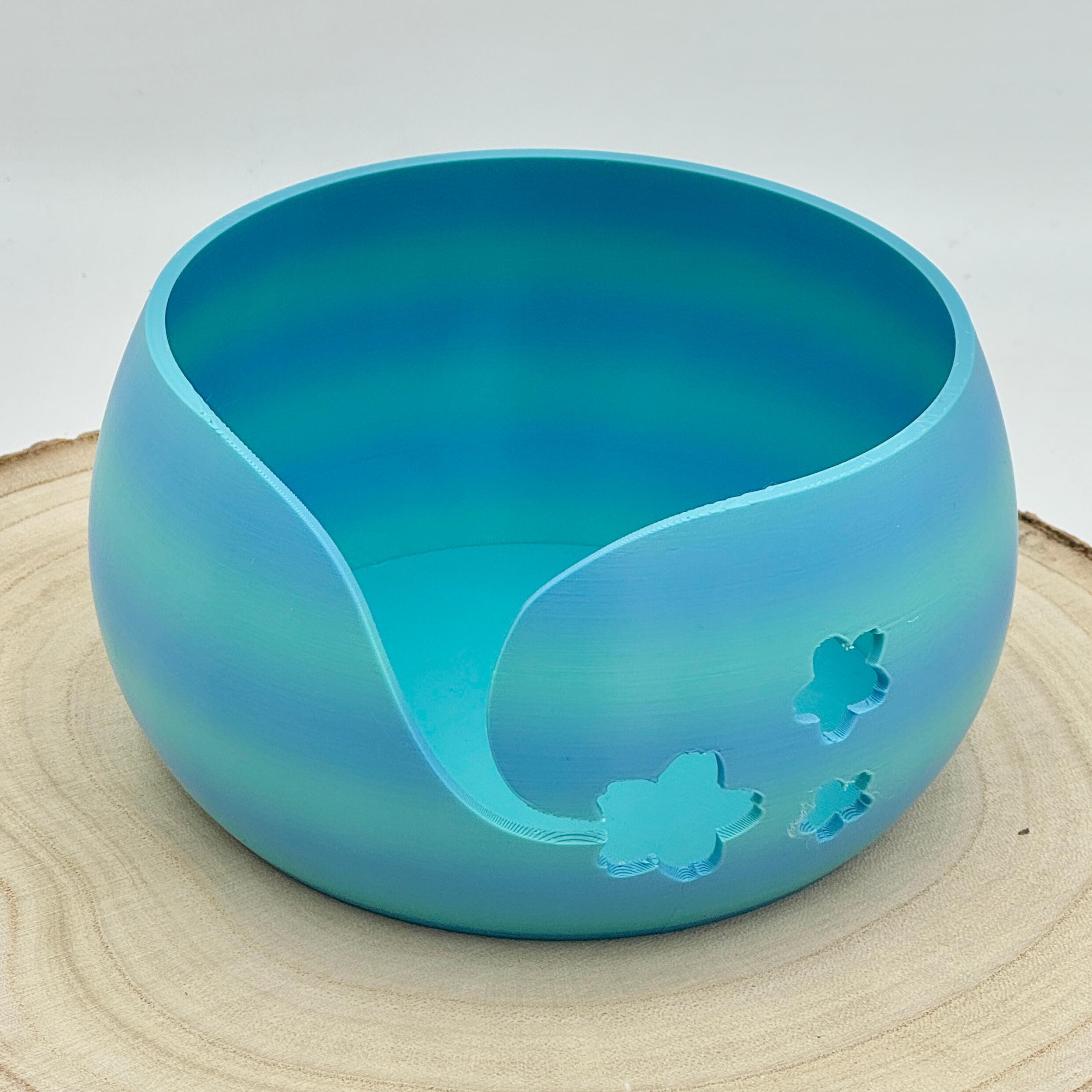 an image of a floral themed yarn bowl in shades of blue