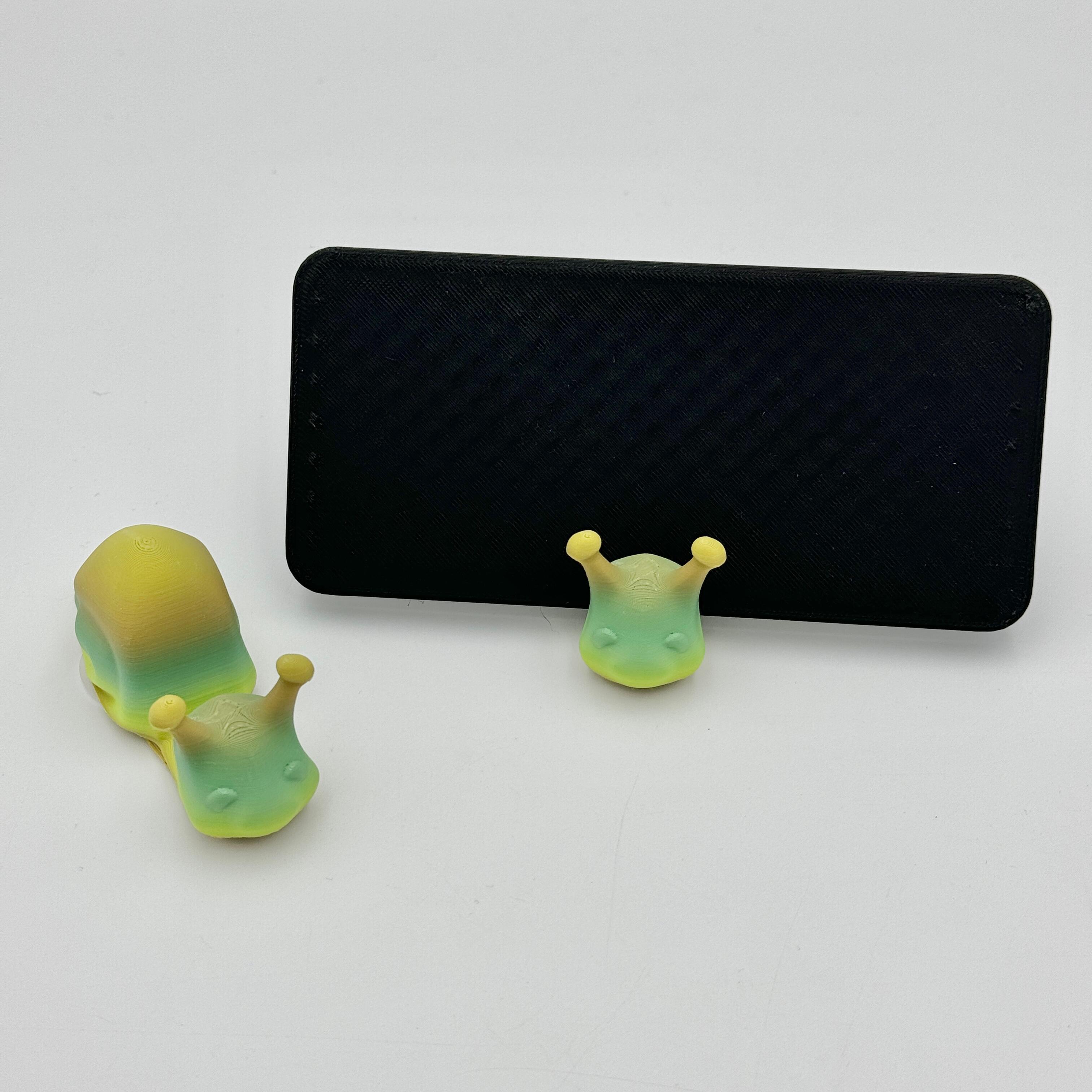 an image of a matcha green snail mobile phone holder