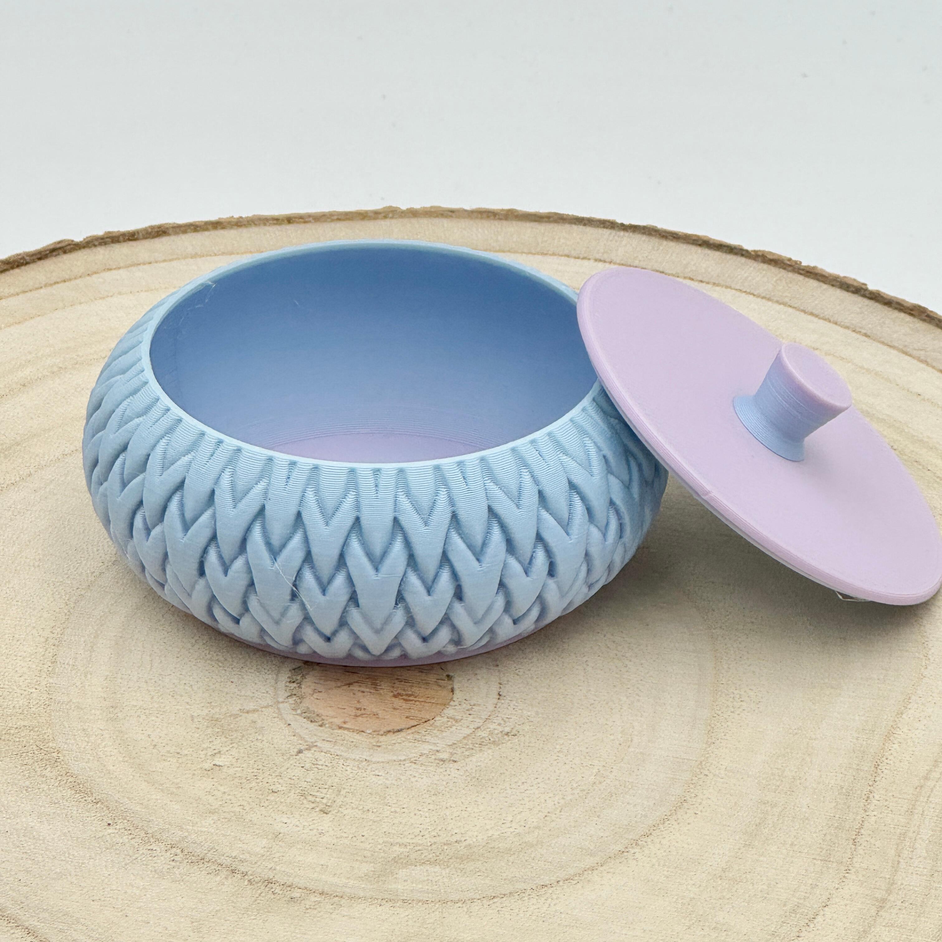 an image of a stackable lidded pot in pastel blue shades