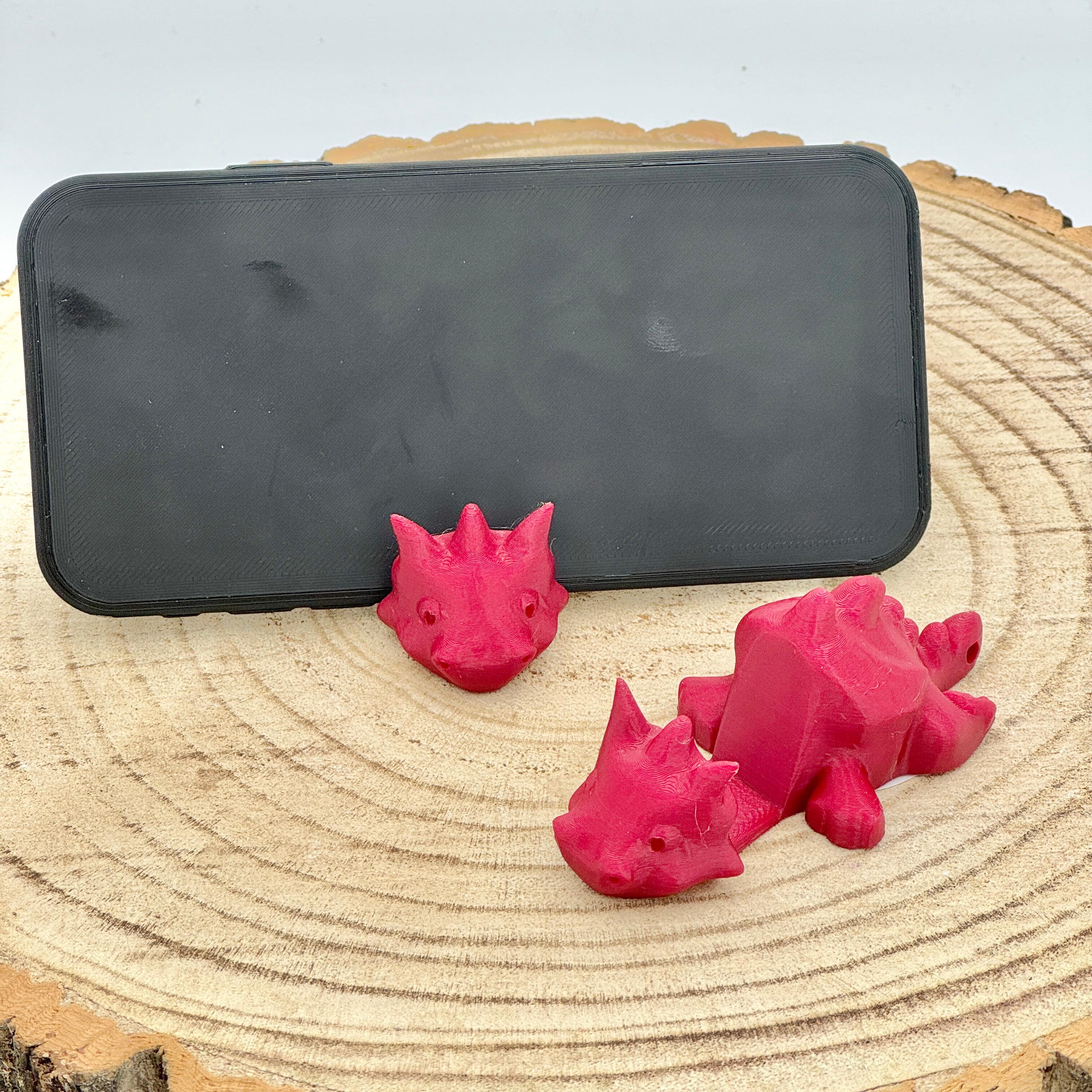 an image of a red dragon mobile phone holder