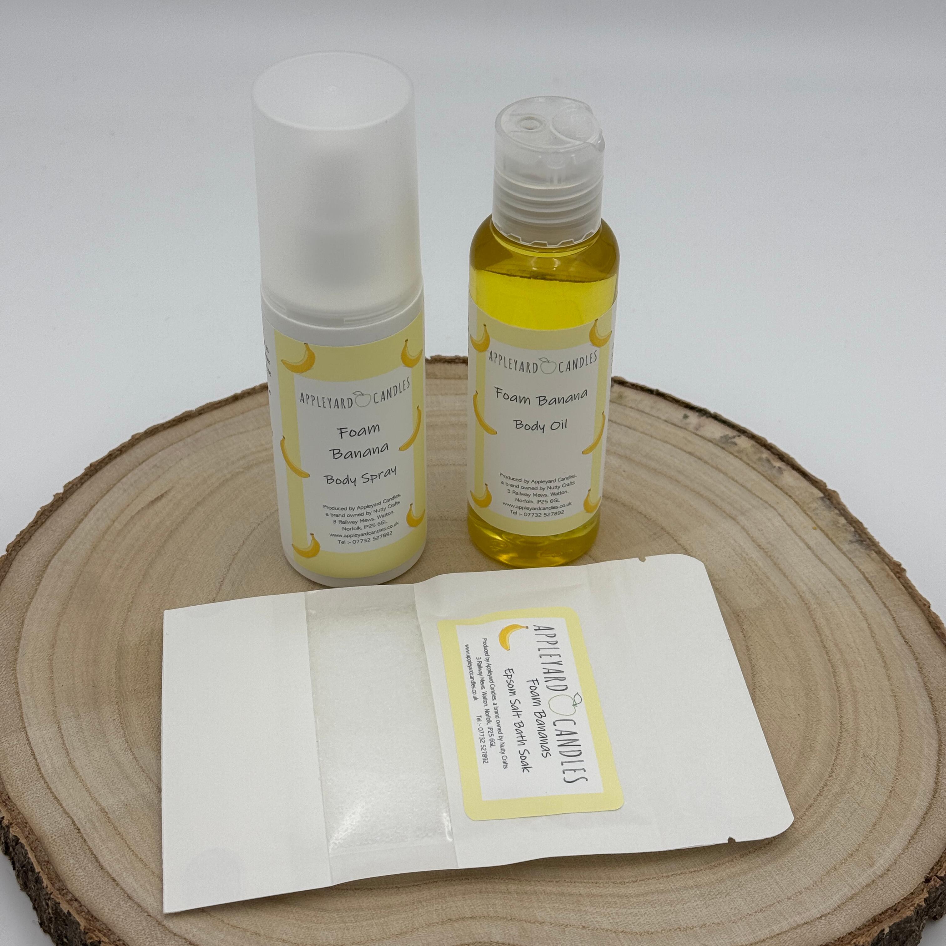 an image of a bottle of body oil, a body spray and a matching sample of bath salts