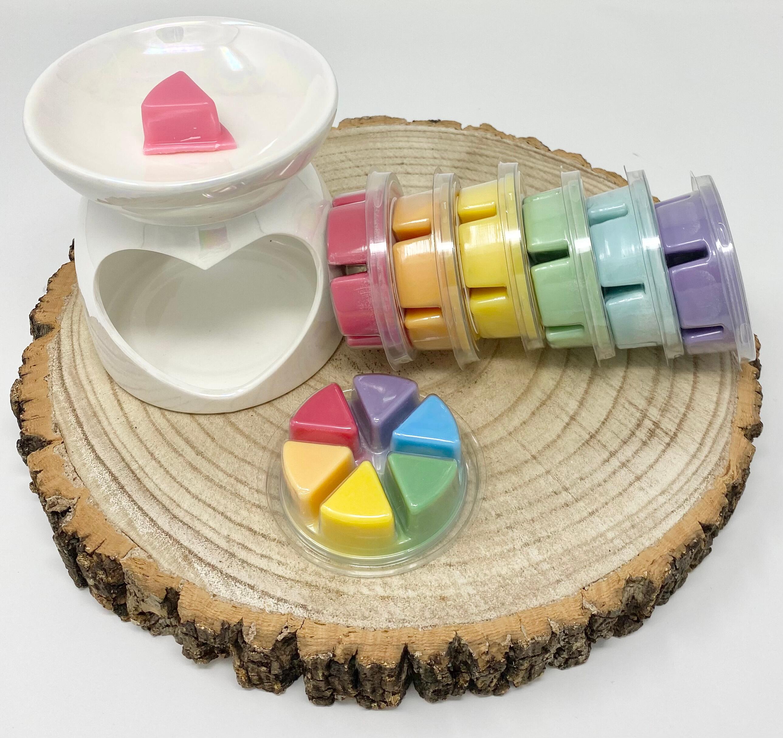 an image of rainbow coloured wax melt pots
