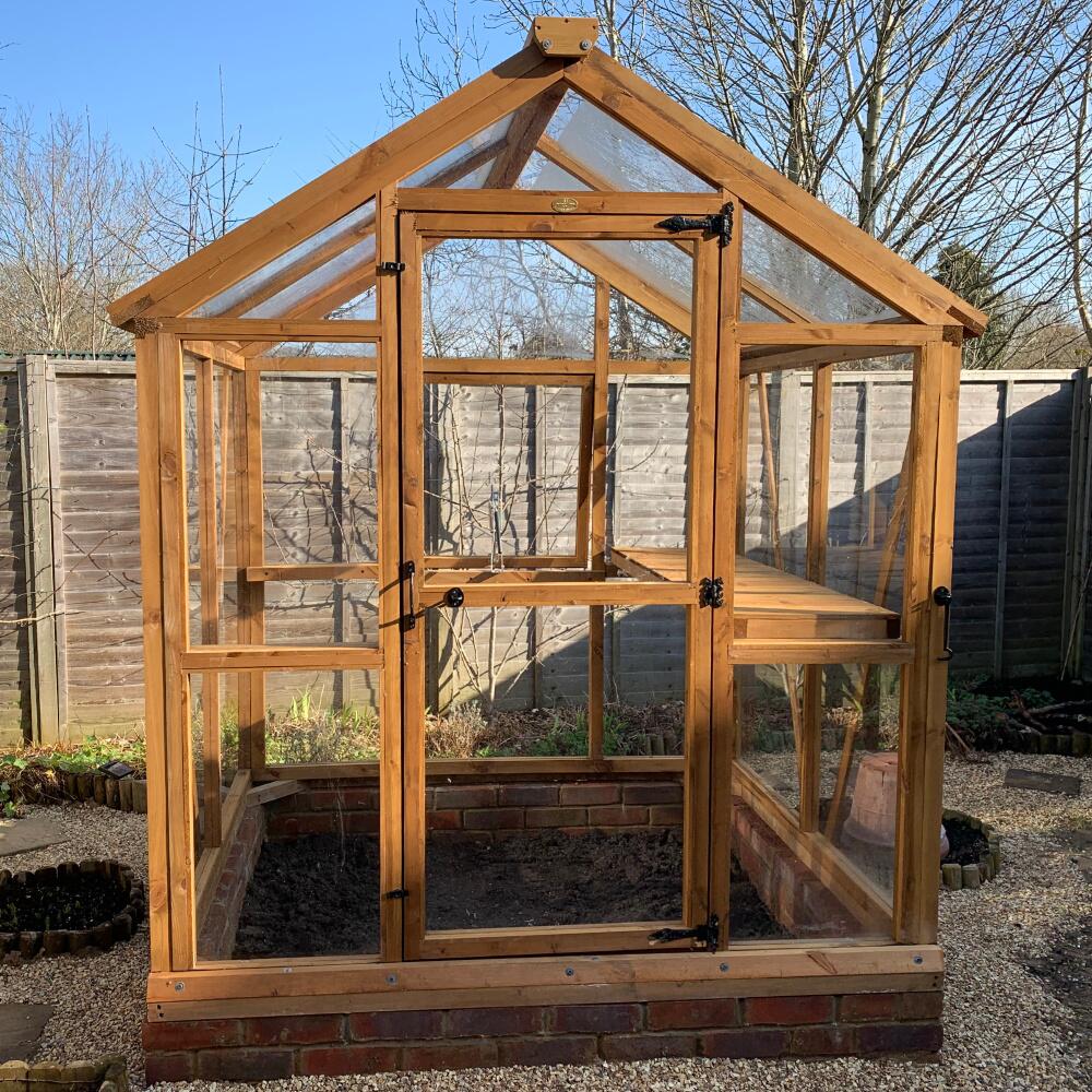 Timber greenhouse with horticultural glass