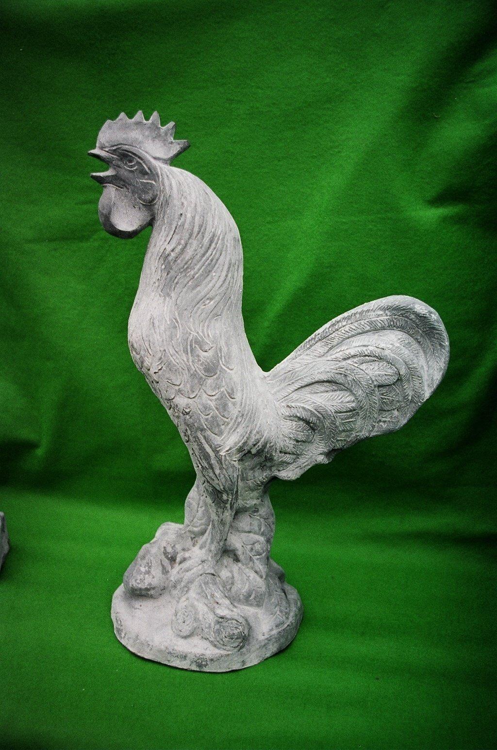 Standing lead Rooster with a green back gorund