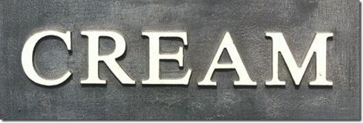 Lead sign with the word Cream painted in cream.