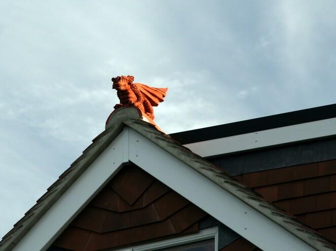 Terracotta half round dragon finial on gable end extension