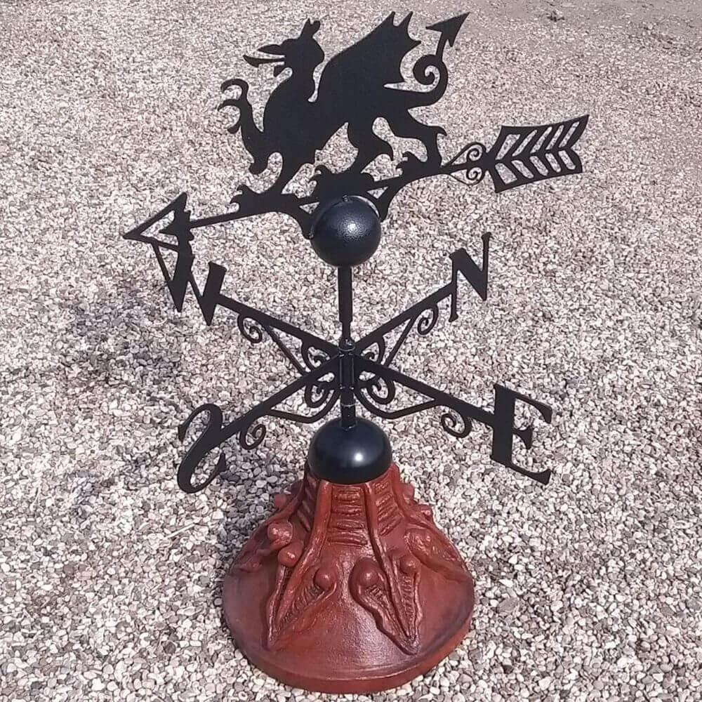 Welsh dragon weathervane fixed to a round ridge tile capping
