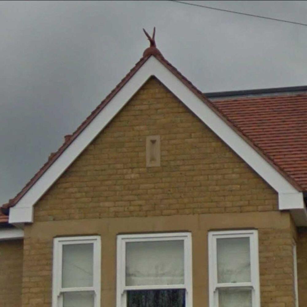 Hawk finial installed on a gable end