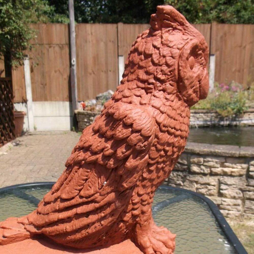 Terracotta owl finial in the garden