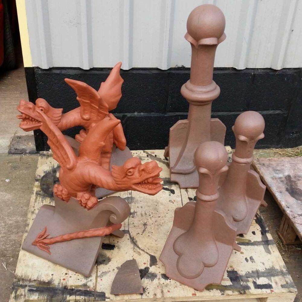 Oriental roof wyvern finial colour match with ball top finials on a pallet