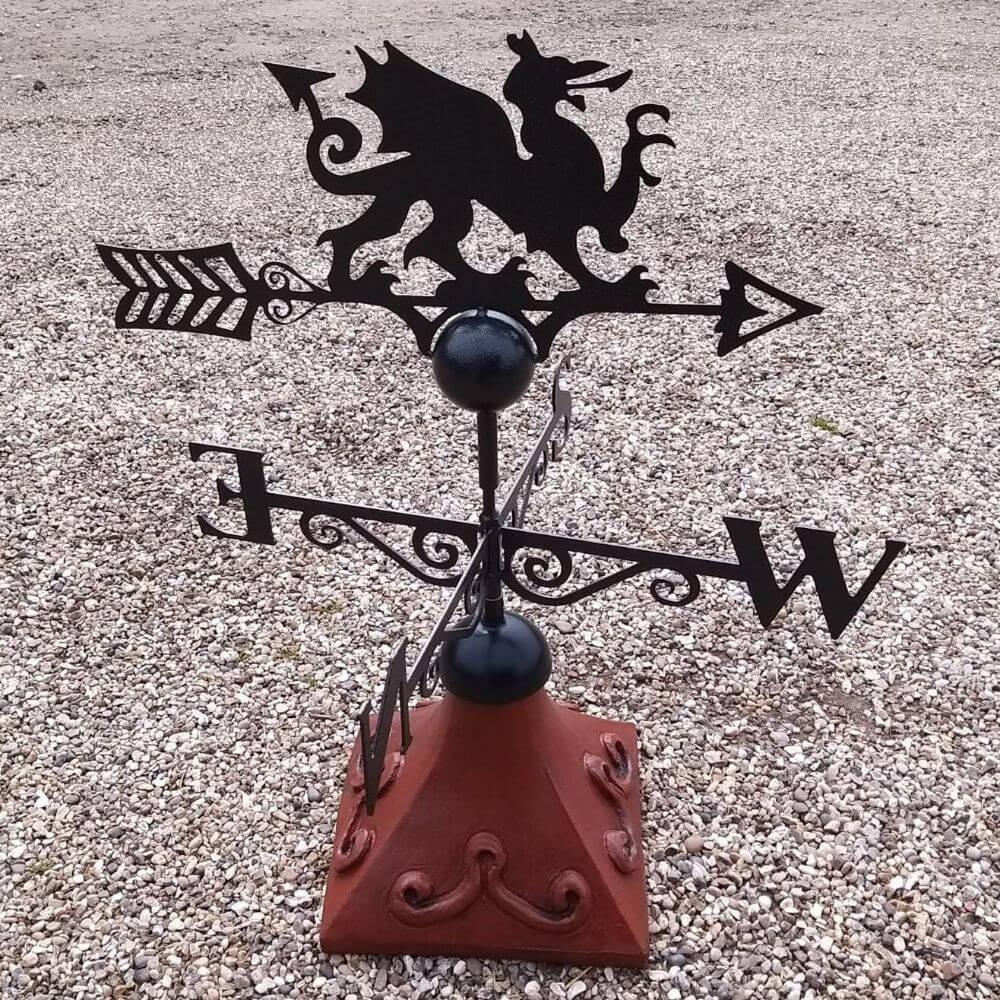 Welsh dragon weathervane installed on a square ridge tile