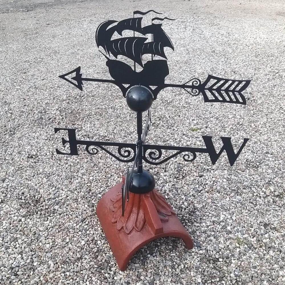 Galleon weathervane fixed to a half round roof tile