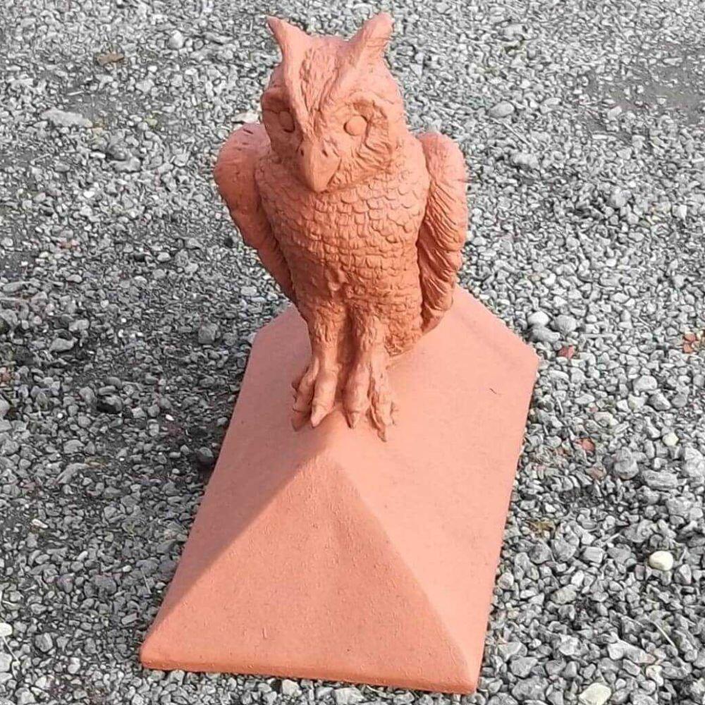 Block end owl roof finial