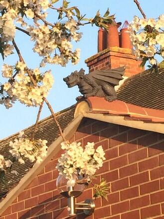 Dragon finial on gable end extension roof