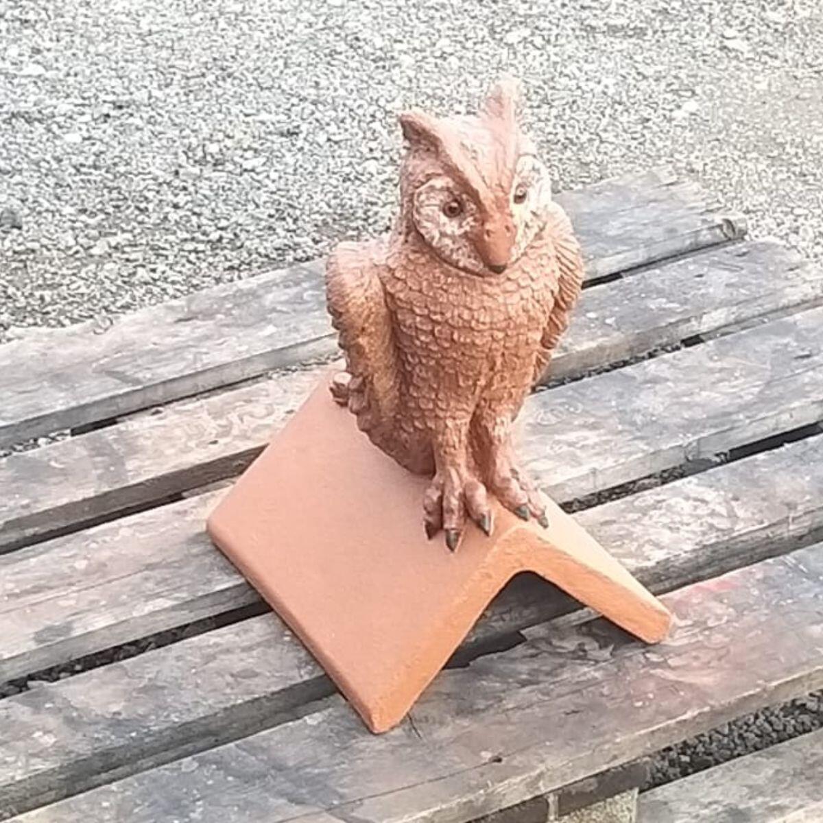 Owl hand painted roof finial on a wooden pallet