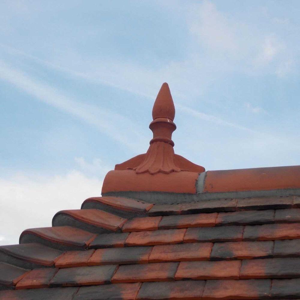 Spike finial half round ridge finial installed on a roof
