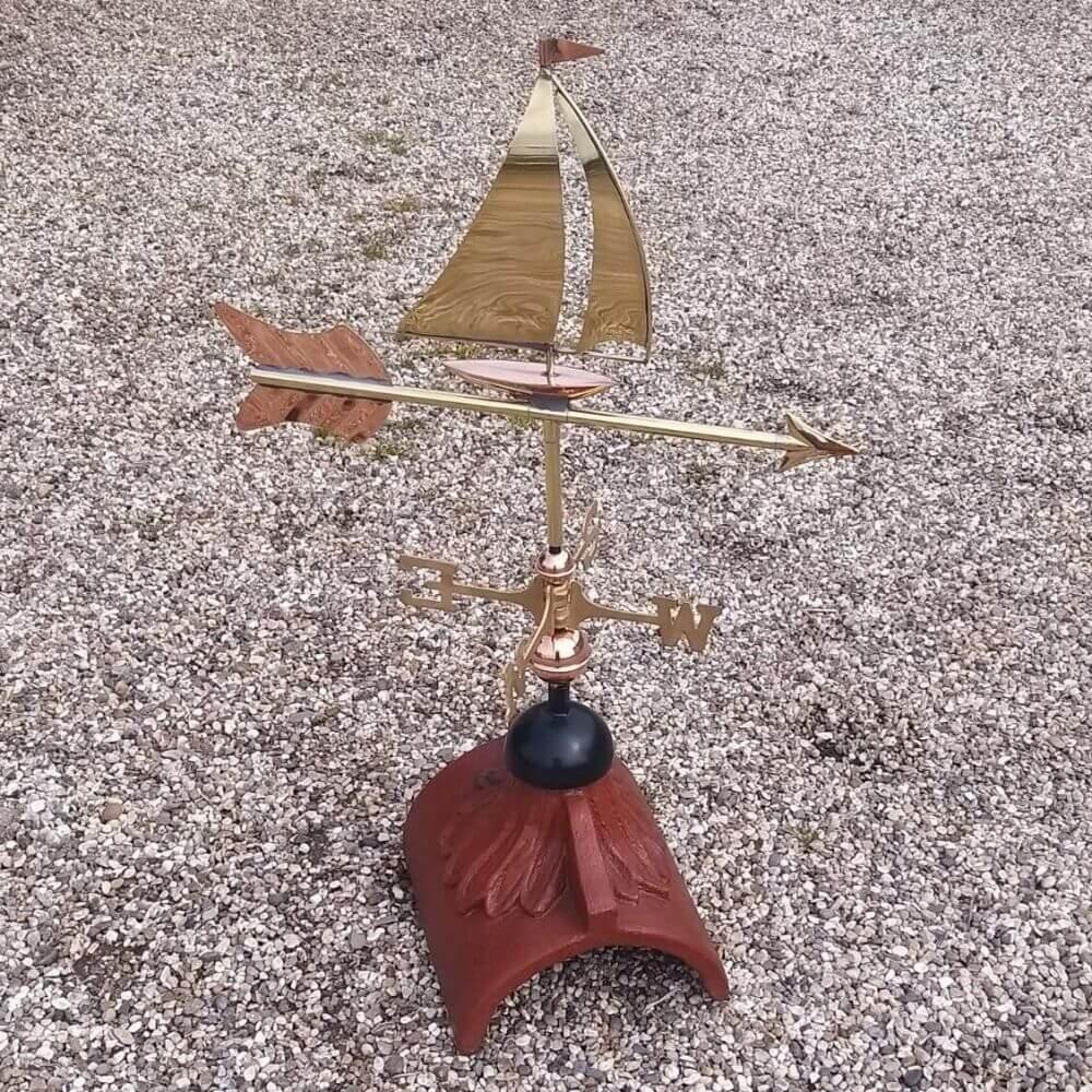 Sailboat weathervane in copper fitted to a square ridge tile