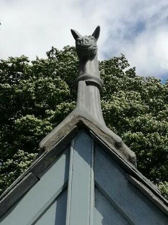 Angled slate grey horse finial on roof